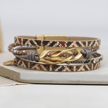 Load image into Gallery viewer, Printed leather bracelet with golden linked double ellipse
