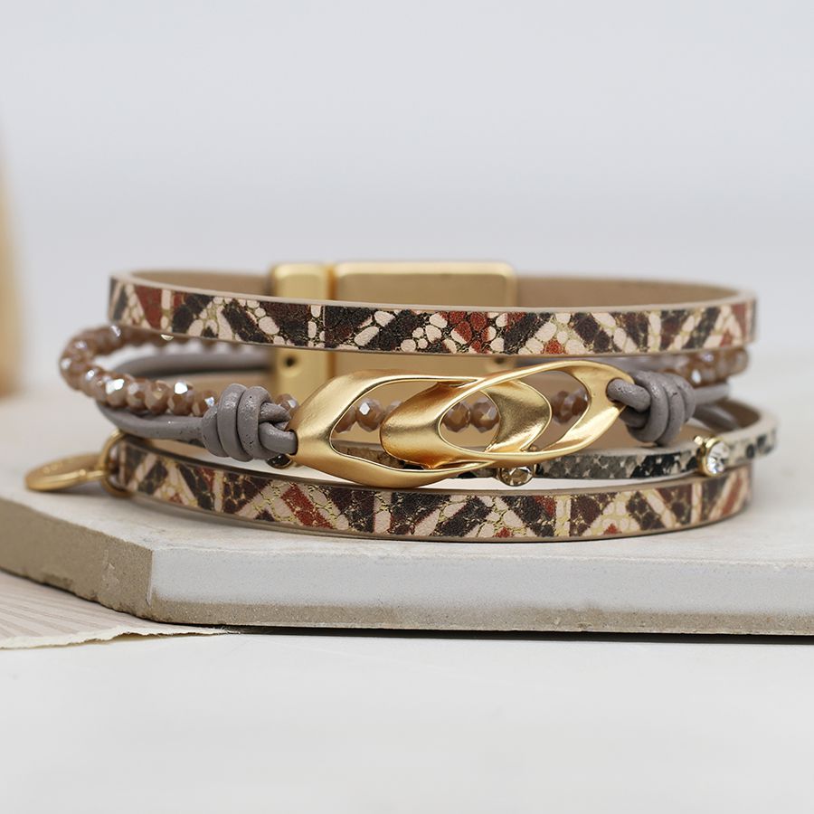 Printed leather bracelet with golden linked double ellipse