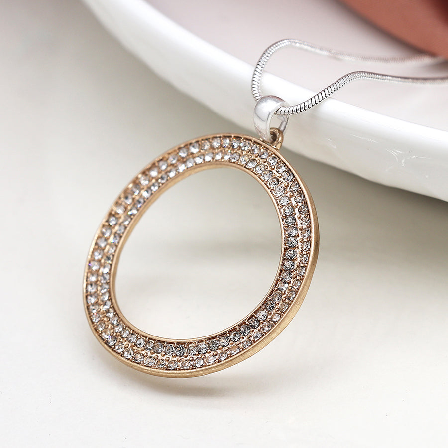 Faux gold tilted oval necklace with crystals on a silver plated snake chain