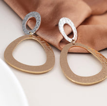 Load image into Gallery viewer, Silver plated and faux gold worn finish small and large hammered shape earrings
