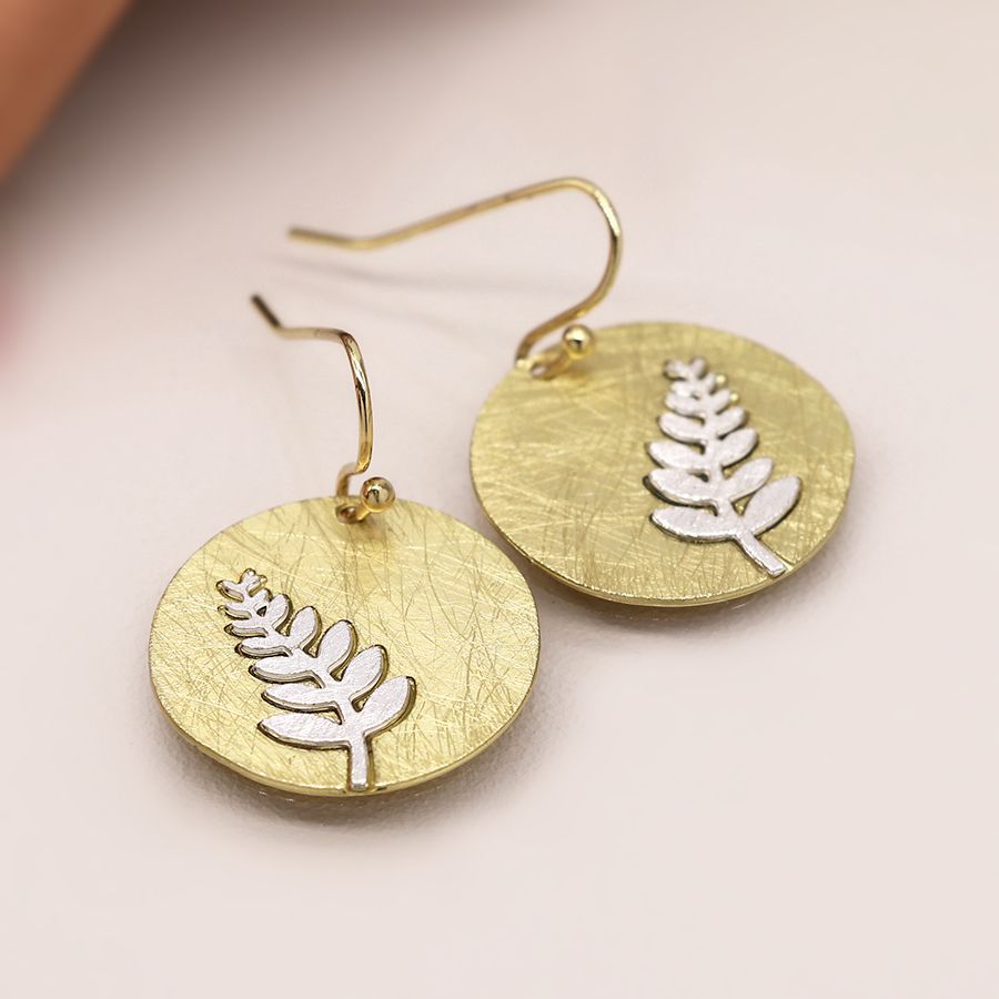 Faux gold scratched disc earrings with silver plated fern inlay