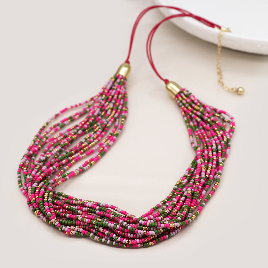 Pink mix multi strand necklace with golden fastening