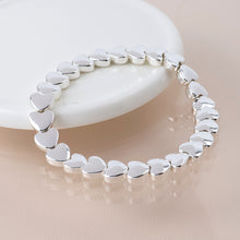 Load image into Gallery viewer, Silver plated polished small hearts stretch bracelet
