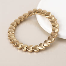 Load image into Gallery viewer, Gold plated polished small hearts stretch bracelet
