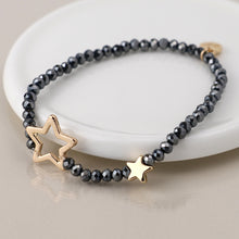Load image into Gallery viewer, Black bead and golden stars bracelet
