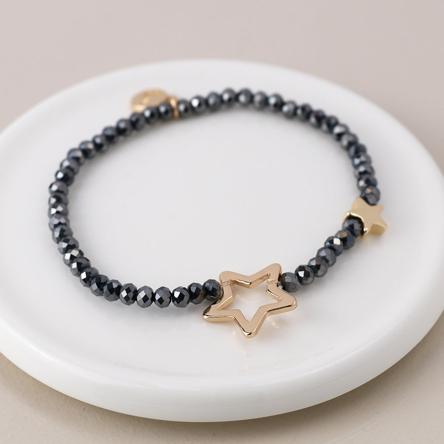 Black bead and golden stars bracelet