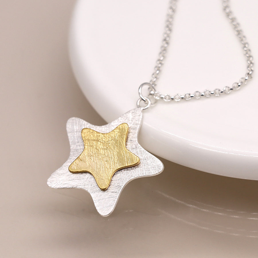 Silver plated and golden layered star necklace
