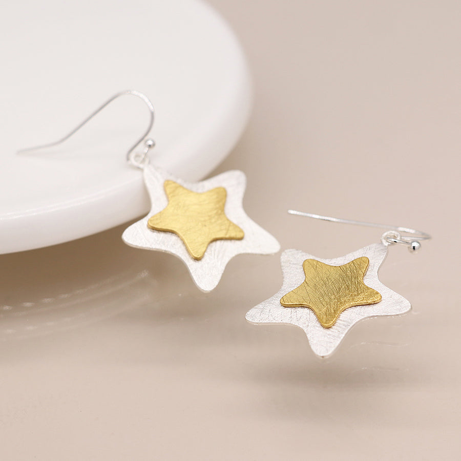 Silver plated and golden layered star earrings