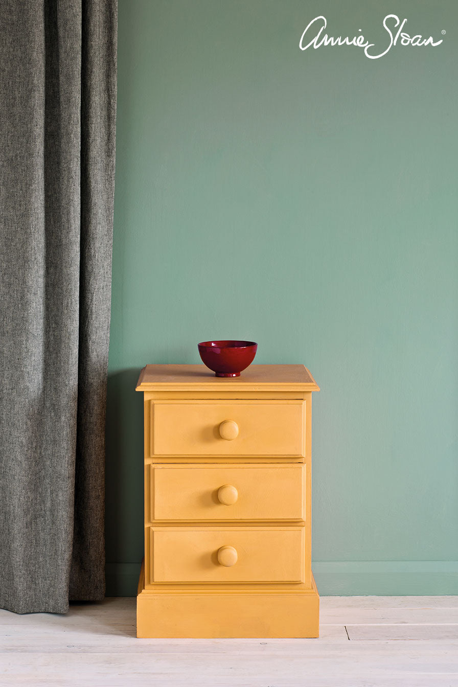 Painted in Annie Sloan Arles Chalk Paint,   three-drawer nightstand with round wooden knobs
