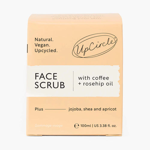 UpCircle Face Scrub packaging with coffee and rosehip oil on a white background