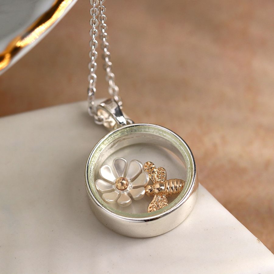 Circle necklace with golden bee and flower